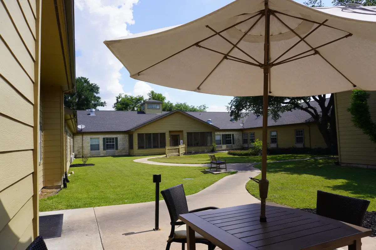 The interior courtyard at Sodalis Austin with paved walking paths and seating