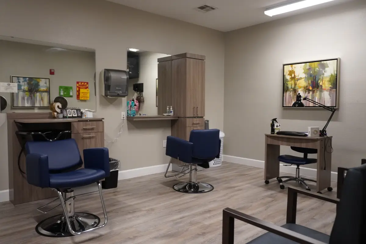 The on-site beauty salon with a styling chair and mirror